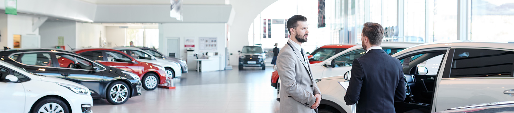 people in car dealership