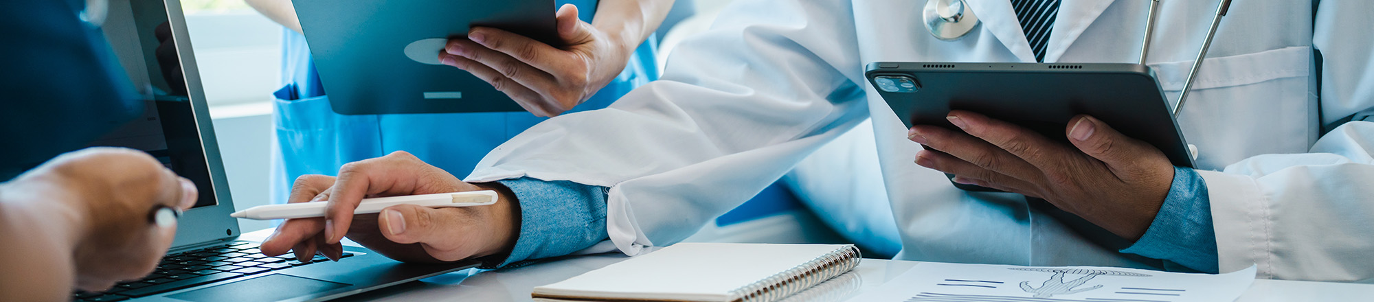 healthcare professionals using digital devices