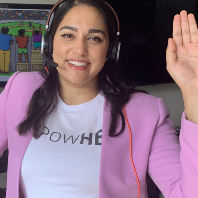 Samantha holding her hand up for womens day