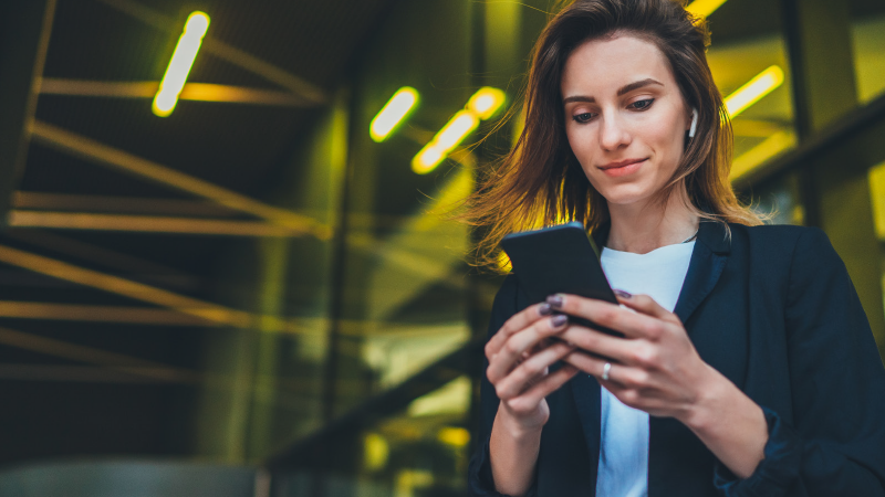 photograph of woman on smartphone