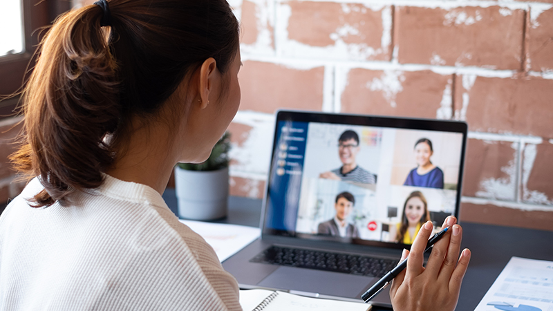 person waving to webinar