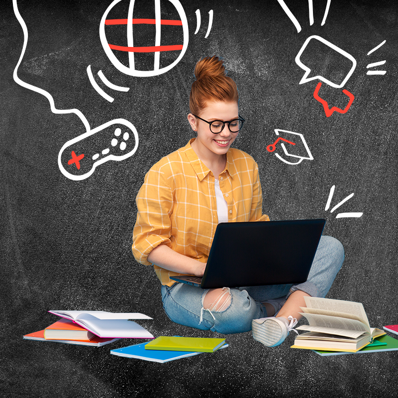 teenage girl studying with chalkboard drawings behind her