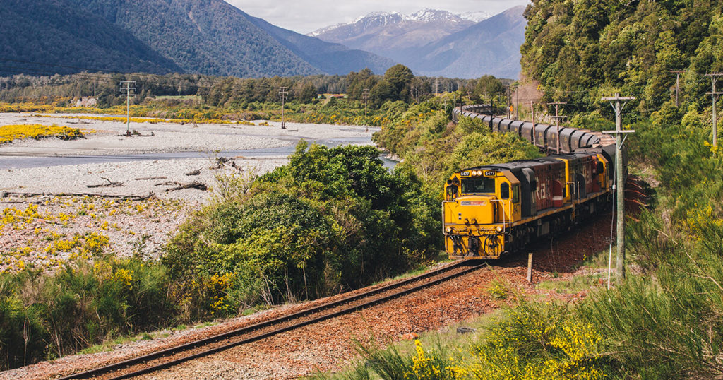 kiwirail vehicle travelling through mountain pass