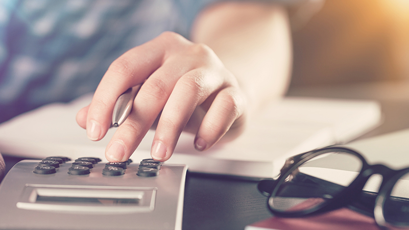 person using calculator