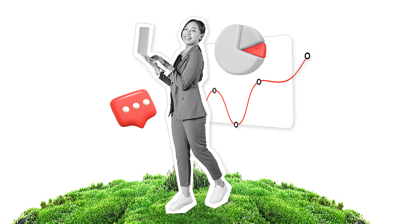 woman holding laptop in front of foliage