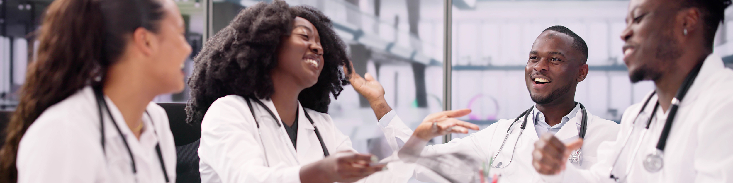 medical professionals learning from a digital device
