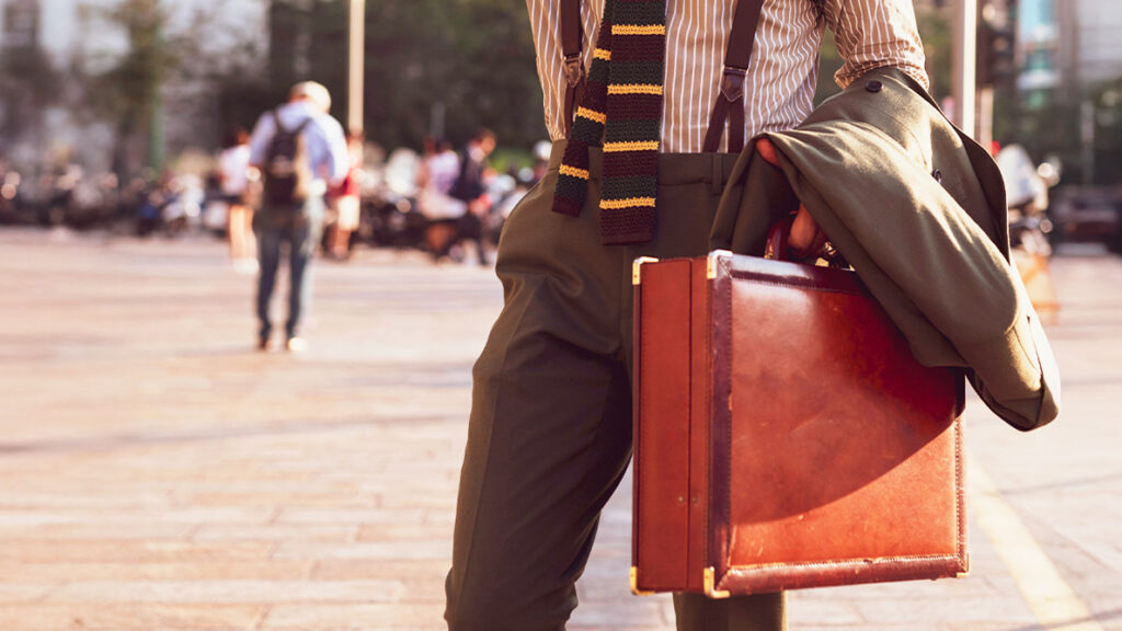 Man with briefcase going to work for his first day